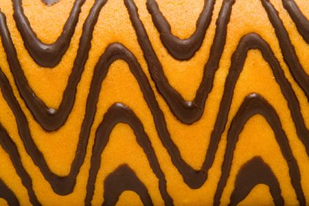 surface of cake with a chocolate as a background