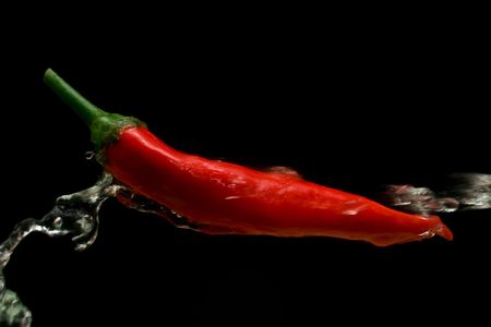 cayenne and water on a black backgroundの写真素材