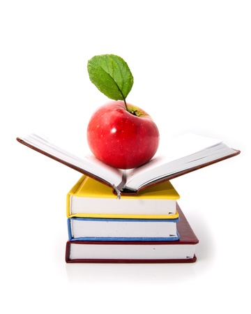 books and apple on a white background の写真素材