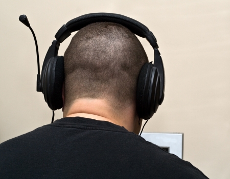 A man is in earpiecessの写真素材