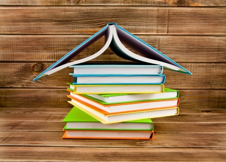 pile of books on a wooden backgroundの写真素材