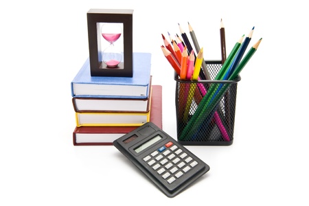 books, clock and pencils on a white background の写真素材