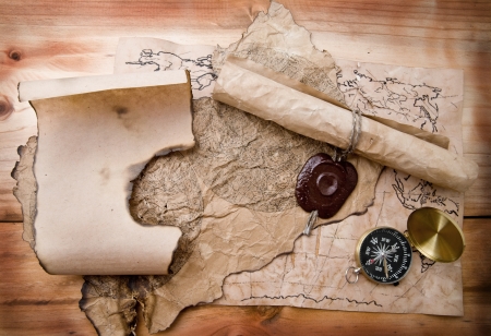 old paper and compass on a wooden background の写真素材