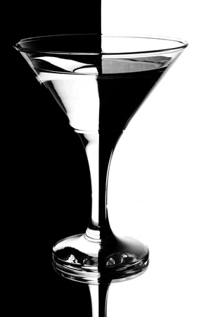tall wine glass for a martini on a black background の写真素材