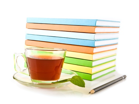 books, pencil and cup tea on a white backgroundの写真素材