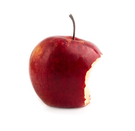 bitten red apple on a white background の写真素材