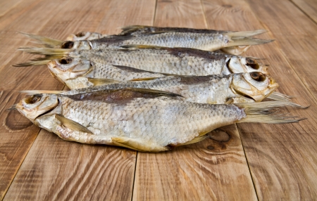 dried fish on a wooden table の写真素材