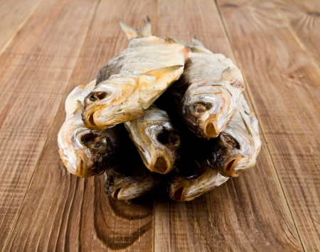 dried fish on a wooden table