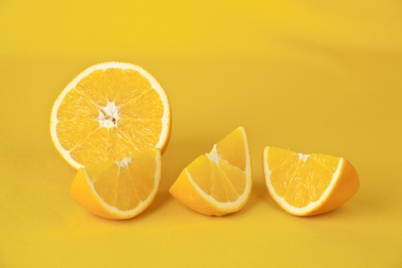 oranges on a yellow background の写真素材