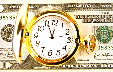 clock and dollars on a white backgroundの写真素材
