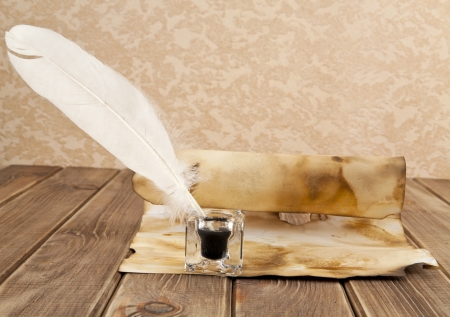 old paper and pen on a white backgroundの写真素材