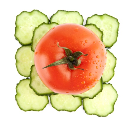 cucumbers and tomatoes on a white backgroundの写真素材