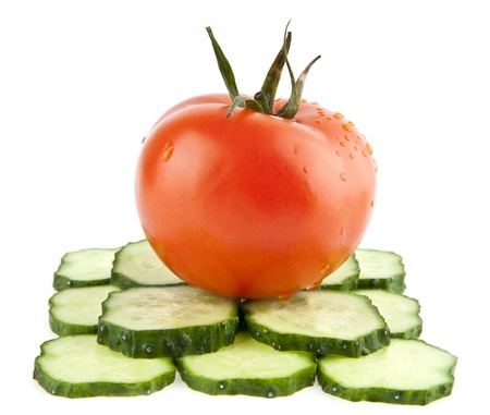 cucumbers and tomatoes on a white backgroundの写真素材