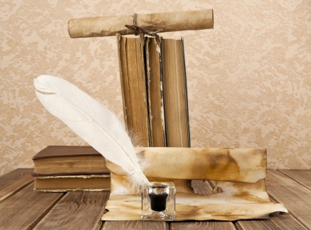 old books and pen on a wooden tableの写真素材