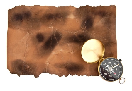 compass and old paper on a white background