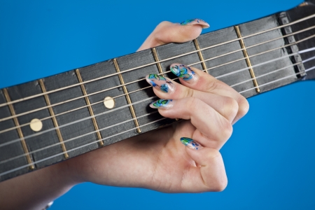 guitar fretboard on a blue backgroundの写真素材