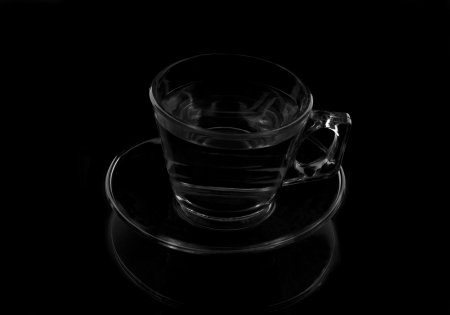 a cup with water on a black backgroundの写真素材