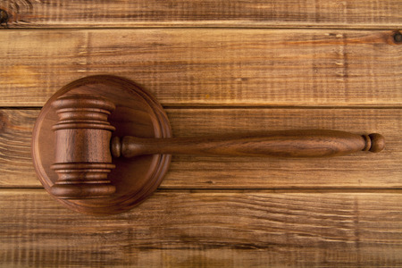 hammer on a wooden tableの写真素材