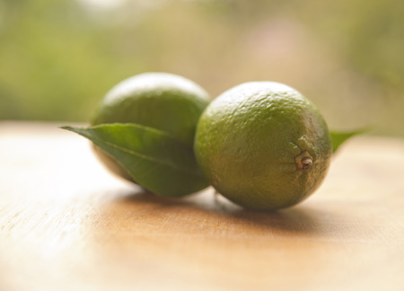 lime on a wooden tableの写真素材