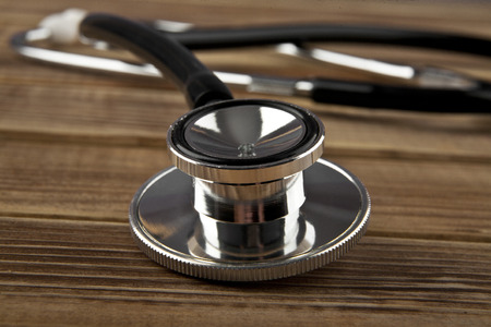 Stethoscope on wooden backgroundの写真素材