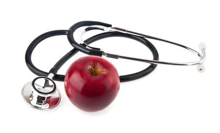 apple and stethoscope on a white background の写真素材