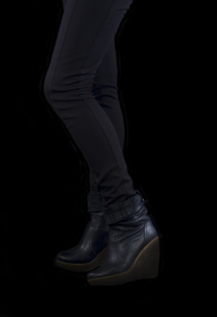 female legs on a black backgroundの写真素材