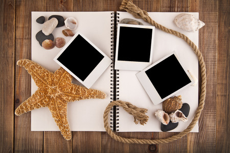 picture with cockleshells and stone on a wooden backgroundの写真素材