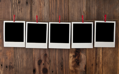 photo frames on wood background