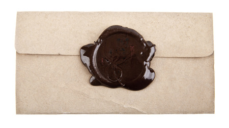 Old paper with wax stamp on a white background