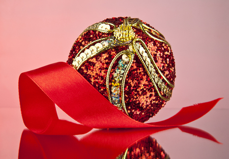 ball for a decoration on a red backgroundの写真素材