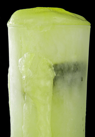frozen lime juice on a black backgroundの写真素材