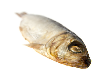 the smoked sprat is isolated on a white backgroundの写真素材