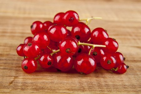 berries currants on a wooden background closeupの写真素材