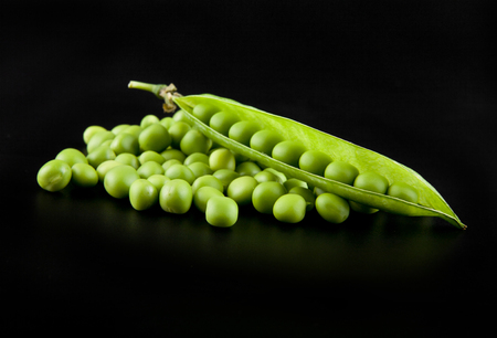 green peas on a black background closeupの写真素材