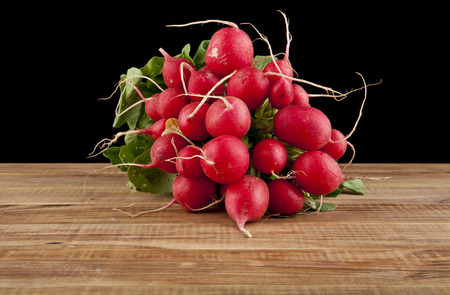 radishes on a black backgroundの写真素材