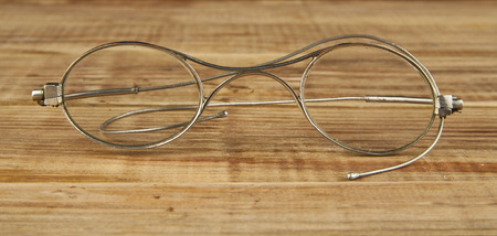 old glasses on a wooden backgroundの写真素材