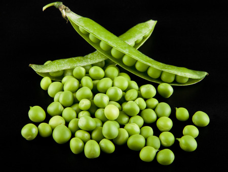 green peas on a black background closeupの写真素材