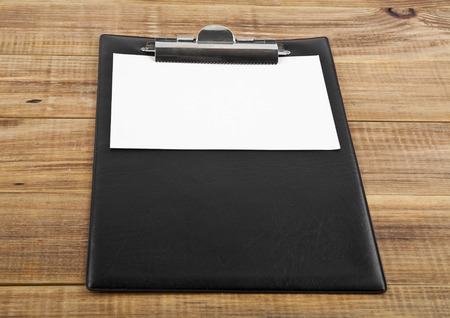 blank clip board on wooden backgroundの写真素材
