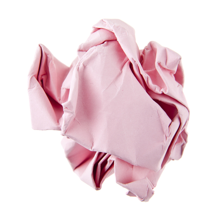 pink crumpled paper isolated on white backgroundの写真素材