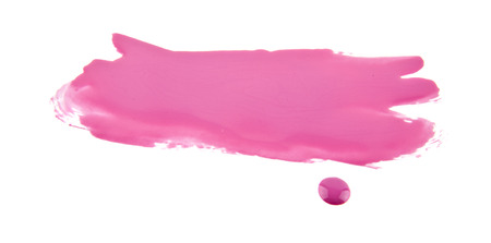 pink spot of spilled nail polish isolated on white backgroundの写真素材