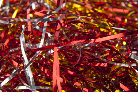 texture of red and golden shiny stripes as backgroundの写真素材