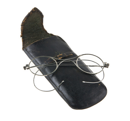 old glasses in a black leather case isolated on white backgroundの写真素材