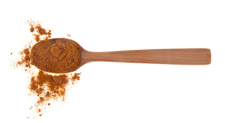 hot red pepper in a wooden spoon isolated on a white backgroundの写真素材