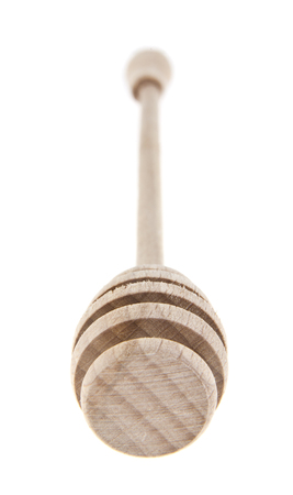 wooden spoon for honey isolated on white backgroundの写真素材