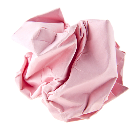 pink crumpled paper isolated on white backgroundの写真素材