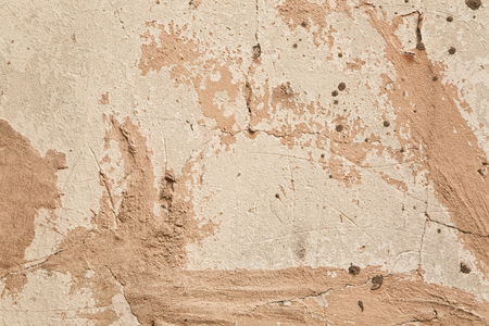 beige wall with a crack as a backgroundの写真素材
