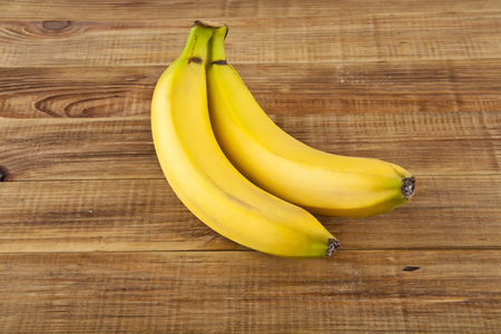 bananas on a wooden backgroundの写真素材