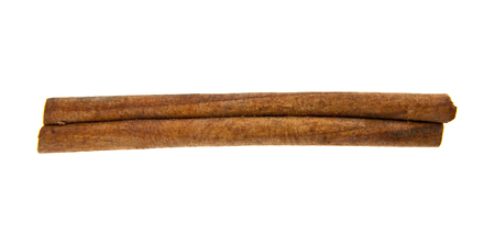 cinnamon sticks isolated on white backgroundの写真素材