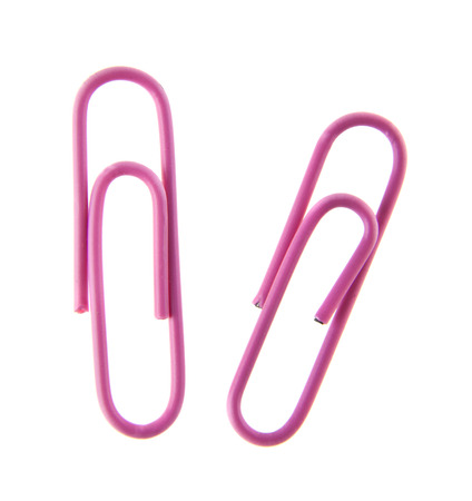 pink paper clip isolated on white backgroundの写真素材