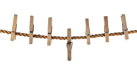Wooden clothespins on a rope isolated on a white backgroundの写真素材